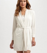 Wrap yourself in this vibrant design for a luxurious take on relaxation. Long sleeves Self belt About 36 from shoulder to hem Polyester Machine wash Imported