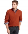 This solid sweater from Izod will step-up to become your go to layering piece for the season.