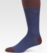 Contrast cuff, heel and toe define comforting socks that offer warmth without bulk. Mid-calf height Ribbed cuff 72% cotton/26% nylon /2% spandex Machine wash Imported 