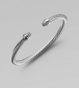 A classic Yurman cable design, in sterling silver with sparkling end caps of pavé diamonds. Diamonds, 0.30 tcw Sterling silver Cable, 5mm Diameter, about 2½ Made in USA
