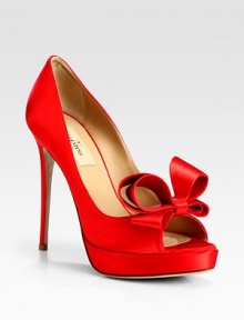 A perfectly-placed dimensional bow tops this towering peep toe silhouette, rendered in luxurious Italian satin. Self-covered heel, 5 (125mm)Covered platform, 1 (25mm)Compares to a 4 heel (100mm)Peep toeSatin upperLeather lining and solePadded insoleMade in Italy A perfectly-placed dimensional bow tops this towering peep toe silhouette, rendered in luxurious Italian satin. Self-covered heel, 5 (125mm)Covered platform, 1 (25mm)Compares to a 4 heel (100mm)Peep toeSatin upperLeather lining and solePadded insoleMade in Italy
