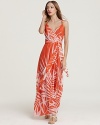 A palm-leaf print decorates this vibrantly hued Milly maxi dress for effortless getaway glamour.