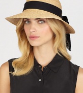 Fine braided raffia accented with polka dot ribbon trim can be worn with brim turned up or rolled down. Bow at back Adjustable sizing cord Brim, about 3½ Imported