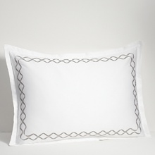 For lovers of fine bed dressing, Ogee Embroidery emulates understated opulence. A sophisticated, contemporary approach to a classic ogee design. Satin stitch and twill texture embroidery create a sleek vertical line. The sham is framed with gently looping corners. For lovers of fine bed dressing, Ogee Embroidery emulates understated opulence. A sophisticated, contemporary approach to a classic ogee design. Satin stitch and twill texture embroidery create a sleek vertical line. The sham is framed with gently looping corners.