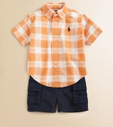 A perfect preppy pairing for the warmer weather, this classic ensemble features a plaid shirt