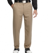 Hit the green with confidence and classic style in these sleek microfiber golf pants from SHARK Greg Norman for Tasso Elba.