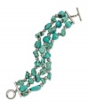Add a splash of natural color. Lauren by Ralph Lauren's soothing three-row bracelet features nugget-shaped reconstituted turquoise. Set in antiqued silver tone mixed metal with toggle closure. Approximate length: 7-1/2 inches.