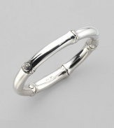 From the Bamboo Collection. The unique look of bamboo, recreated in a stuningsterling silver bangle. This design was expressly created to support an afforestation project on Nusa Penida, an arid island off the coast of Bali. For every purchase, John Hardy will donate a portion of the retail price to the cost of planting bamboo. This bangle helped plant 16 bamboo seedlings. Sterling silver Diameter, about 2½ Width, about ¼ Hinged with push-lock clasp Made in Bali