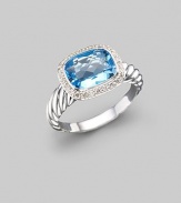 From the Noblesse collection. A glimmering blue topaz, surrounded by diamonds, balances elegantly on a cable band of sterling silver. Diamonds, 0.21 tcw Blue topaz Sterling silver Imported