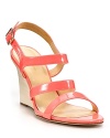 A sherbet hue rests atop a pale stacked wedge, on a summery silhouette we can't wait to wear. From kate spade new york.