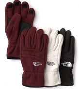 Cozy fleece ensures warmth and comfort in these essential winter gloves from The North Face®.