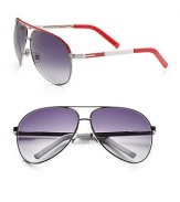 Large metal aviator sunglasses have double bridge with spring hinge, t-bar logo set temple and brow color treatment. Available in red/silver frame with grey lens or white/silver frame with grey lens. Made in Italy. 
