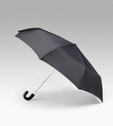 Compact retractable nylon umbrella with leather handle. Sleeve included Made in Italy 
