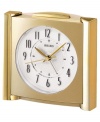 Set this distinguished clock upon any table, desk or mantle for an easy touch elegance. Goldtone mixed metal case. Round white dial with logo and numeral indices. Ascending alarm with snooze. One AA battery included. Measures approximately 7 x 4-2/5 x 4-1/5 inches.  One-year limited warranty.