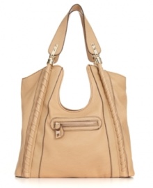 This unique tote from Jessica Simpson will make you do a double take! Beautiful piped trim, polished goldtone hardware and an eye-catching cut-out middle decorate this fabulous bag for a subtle notice-me style. This unique tote from Jessica Simpson will make you do a double take! Beautiful piped trim, polished goldtone hardware and an eye-catching cut-out middle decorate this fabulous bag for a subtle notice-me style.