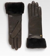 Durable deerskin leather accented with luxurious cashmere lining and shearling sheepskin cuff.Metal logo detailAbout 11 longSpecialist dry cleanImportedFur origin: Spain