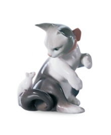 Watch the classic game of cat and mouse unfold with this irresistible figurine, handcrafted in premium Lladro porcelain. Watch the classic game of cat and mouse unfold with this irresistible figurine, handcrafted in premium Lladro porcelain.