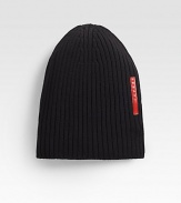 Wool channel ribbed beanie hat with signature leather logo detail.WoolDry cleanMade in Italy