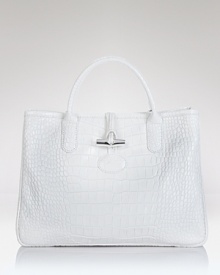 Longchamp's croc embossed leather tote exudes poise, boasting top handles and a structured silhouette. In exotic style, this bag is ready to meet daytime demands. Longchamp's croc embossed leather tote exudes poise, boasting top handles and a structured silhouette. In exotic style, this bag is ready to meet daytime demands.