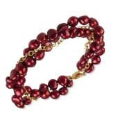 Go for a subtle hint of color. This beautiful bracelet features cranberry-colored cultured freshwater pearls (6-7 mm) set in 18k gold over sterling silver. Approximate length: 7-1/2 inches.