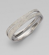 EXCLUSIVELY AT SAKS.COM. Curvaceous rows of pavé crystals decorate the wrist.Crystals Rhodium plated Width, about ¾ Diameter, about 2½ Push lock closure Imported