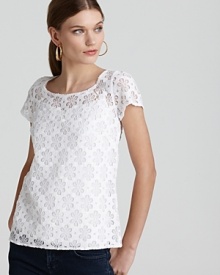 Ladylike and lovely, this Lilly Pulitzer top steps into the spotlight with a sheer lace overlay. Approach the delicate silhouette with bags, shoes and jewelry in pastel hues for a feminine finish.