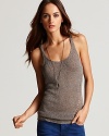 An elegant Vince linen sweater tank replaces tee styles for a polished look with everything from jean shorts to boyfriend-style khakis. This sheer version is a favorite for the season and with intricate sheer knit detailing it's no secret why.