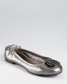 Tory Burch's iconic Reva ballet is updated for the season in metallic pewter leather and polished gunmetal hardware. Tory Burch's iconic Reva ballet is updated for the season in metallic pewter leather and polished gunmetal hardware.