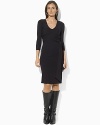 A sleek jersey dress is crafted in a figure-flattering wrap silhouette and finished with chic three-quarter-length sleeves.