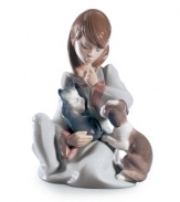 Kitten and puppy vie for attention and a warm lap from their loving owner in the Cat Nap figurine. She's ready for bed too, wearing a long nightgown. From Lladro.