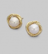 From the Infinity Collection. Two elegant, intertwined bands of 18k yellow gold surround an exquisite, naturally hued pearl. 6mm white pearls 18k yellow gold Diameter, about ½ Post back Imported