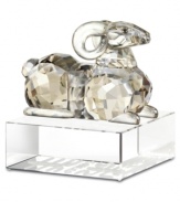 A Chinese symbol of affection among families, sheep have a place in any home. Crafted in smooth and faceted silvertone crystal, this Swarovski figurine features an authentic Asian design atop a base engraved with English and Chinese seal script.