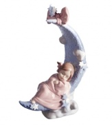 Sweet dreams. A little angel cuddles up to a crescent moon in the Heavens Lullaby figurine, featuring delicately glazed porcelain from Lladro.