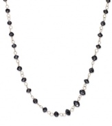 An elegant combination. Faceted black diamond beads (13 ct. t.w.) enhance the appeal of this link necklace, set in 14k gold. Approximate length: 17 inches.