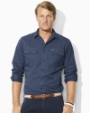 Lightweight cotton chino and utilitarian-inspired details lend rugged appeal and stylish comfort to a classic-fitting military shirt.