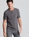 A step-above essential from Vince. The soft cotton henley tee is rendered in a slub pattern and partially concealed button placket and banded sleeves.
