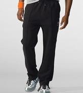 Rendered in luxe Pima fleece, a stretchy athletic pant features utility side zip and back pockets, plus a large RLX logo at the left leg.