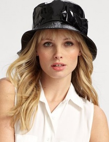 Ward off the weather in this chic patent style, accented with a matching side bow.PolyesterBrim, about 2¾ wideMade in Italy of imported fabric Ward off the weather in this chic patent style, accented with a matching side bow.PolyesterBrim, about 2¾ wideMade in Italy of imported fabric