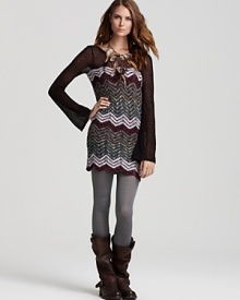 Hang with the hippie-chic crowd in a chevron-stripe Free People sweater dress. The mini silhouette partners with textured tights and slouchy boots for a boho look tinged with '70s appeal--on-trend and fabulous.