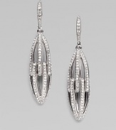 EXCLUSIVELY AT SAKS. Graceful elongated open ovals are set with sparkling crystals in this shimmering design.Crystal Rhodium plated Drop, about 1¾ Post-and-hinge back Imported