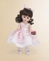 This pretty brunette miss brings birthday wishes to a lucky young lady on her special day.8 cloth dollDressed in a pink, full-skirted frock with floral embroidery and white Mary Jane slippersShe offers a luscious-looking slice of birthday cakeRecommended for ages 3 and upImported