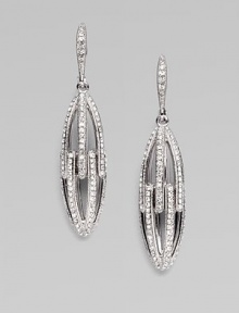 EXCLUSIVELY AT SAKS. Graceful elongated open ovals are set with sparkling crystals in this shimmering design.Crystal Rhodium plated Drop, about 1¾ Post-and-hinge back Imported