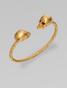 This Swarovski crystal accented design features two goldtone skulls on a textured cuff. Goldtone brassSwarovski crystalsDiameter, about 2½Slip-on styleMade in Italy This Swarovski crystal accented design features two goldtone skulls on a textured cuff. Goldtone brassSwarovski crystalsDiameter, about 2½Slip-on styleMade in Italy