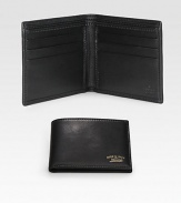 Leather bi-fold wallet accented with Made in Italy by Gucci script gold engraving. Two bill compartmentsSix card slotsClosed: 4.3W x 3.5H x .6DOpen: 8.4W x 3.5HMade in Italy