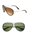 Sleek acetate and metal frames with shiny temple tips. Available in tortoise with brown gradient lens or black with green lens. 100% UV protection Made in Italy