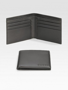 A classic leather bi-fold wallet with cut-out logo detail. Two bill compartments Six card slots 4.3W X 3.5H Made in Italy A classic leather bi-fold wallet with cut-out logo detail. Two bill compartments Six card slots 4.3W X 3.5H Made in Italy
