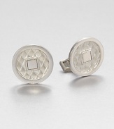 From the Naga Collection. Evoking the look of an ancient coin with its squared hole, a diamond-textured disc of sterling silver forms the centerpiece of an elegant cuff link in a smooth silver setting.Sterling silverSwivel backMade in Bali