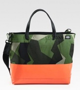 Dipped in latex, this industrial canvas has a water and sandproof bottom for extra durability.Zip closureDouble top handlesAdjustable, removable shoulder strapInterior zip pocketCoated canvas22W x 14H x 6DImported