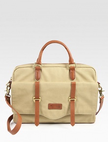 Both trim and roomy, in rugged leather-trimmed canvas, perfectly sized to protect your computer and hold a few other essentials as well.Double top handlesDetachable padded shoulder strapTop zip closeOutside buckle-strap flap pocketInside computer compartment and zip pocketCotton lining15W X 10H X 2DImported Both trim and roomy, in rugged leather-trimmed canvas, perfectly sized to protect your computer and hold a few other essentials as well.Double top handlesDetachable padded shoulder strapTop zip closeOutside buckle-strap flap pocketInside computer compartment and zip pocketCotton lining15W X 10H X 2DImported