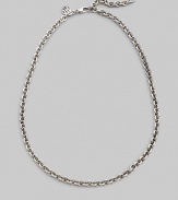 Simple and sophisticated, a bold chain of sterling silver with a signature tag at the clasp. Sterling silver Length, about 20 Lobster clasp Made in Bali